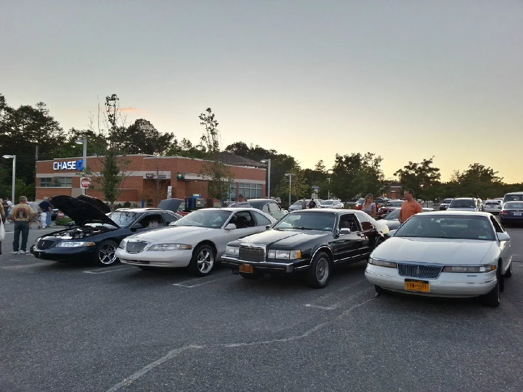 Club members at a car show event